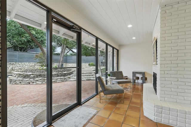 208 Rockwood Park Dr, Fort Worth, TX 76107 - sunroom featuring a brick fireplace