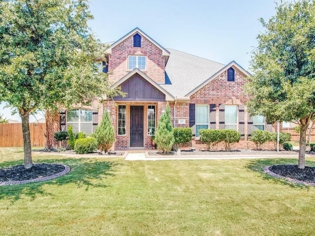 301 Komron Ct, Prosper, TX 75078 - view of front of property with brick siding, a shingled roof, and board and batten siding
