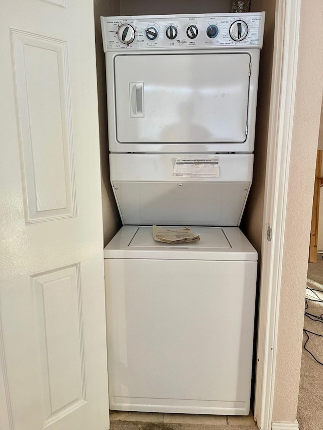817 W Harwood Rd Unit B, Hurst, TX 76054 - laundry room featuring estacked washer and dryer
