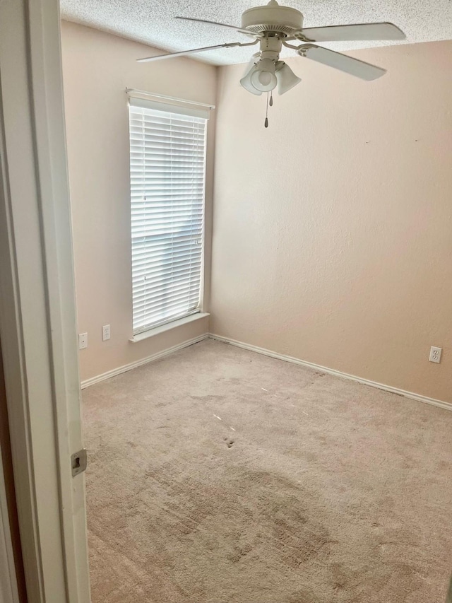 817 W Harwood Rd Unit B, Hurst, TX 76054 - carpeted empty room with ceiling fan and a textured ceiling