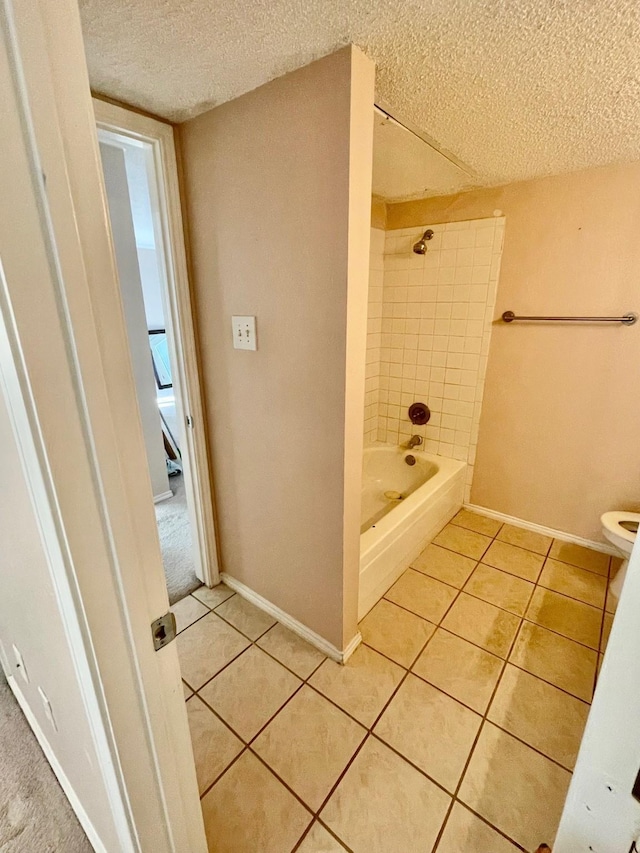 817 W Harwood Rd Unit B, Hurst, TX 76054 - full bathroom featuring a textured ceiling, tile patterned floors, and shower / bath combination