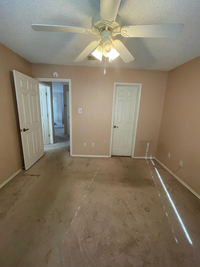 817 W Harwood Rd Unit B, Hurst, TX 76054 - spare room with a textured ceiling, ceiling fan, and carpet floors