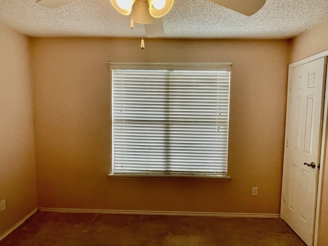 817 W Harwood Rd Unit B, Hurst, TX 76054 - spare room with ceiling fan, carpet flooring, and a textured ceiling