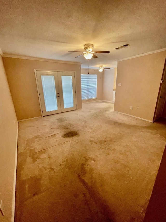 817 W Harwood Rd Unit B, Hurst, TX 76054 - spare room with crown molding, french doors, carpet flooring, ceiling fan, and a textured ceiling