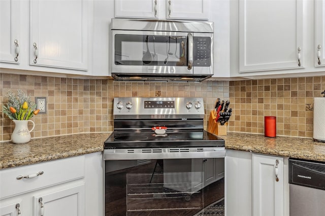 7210 Mercurys Rd, Rowlett, TX 75089 - kitchen with stainless steel appliances, white cabinets, tasteful backsplash, and light stone countertops