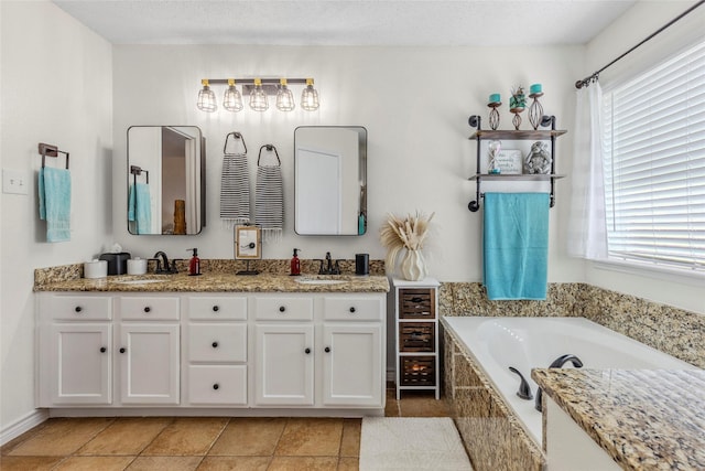7210 Mercurys Rd, Rowlett, TX 75089 - full bath featuring plenty of natural light, double vanity, a garden tub, and tile patterned flooring