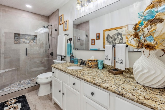 7210 Mercurys Rd, Rowlett, TX 75089 - full bathroom with vanity, a shower stall, and recessed lighting