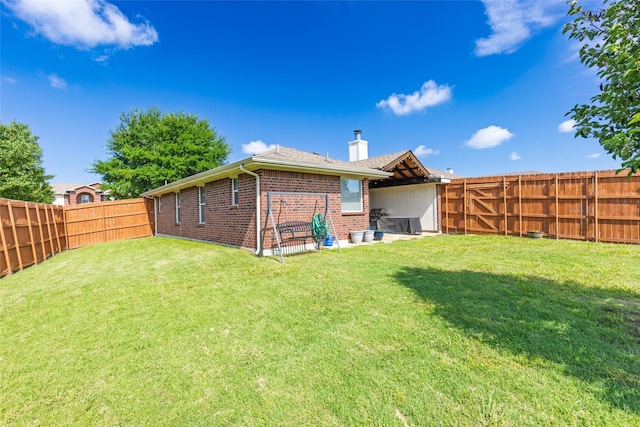 7210 Mercurys Rd, Rowlett, TX 75089 - rear view of house with brick siding, a chimney, and a fenced backyard