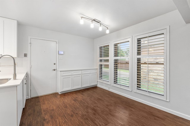 1513 Elk Grove Dr, Richardson, TX 75081 - unfurnished dining area featuring dark wood-type flooring and a sink