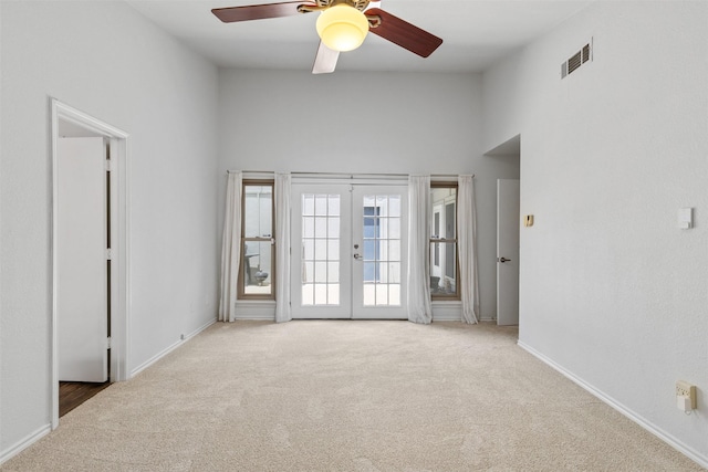 1513 Elk Grove Dr, Richardson, TX 75081 - carpeted empty room with french doors, a high ceiling, and a ceiling fan