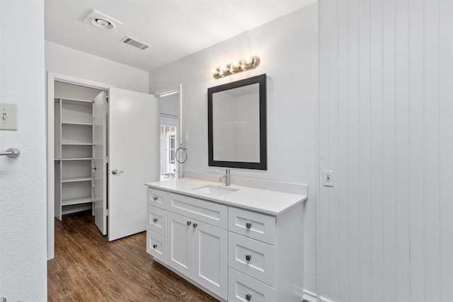 1513 Elk Grove Dr, Richardson, TX 75081 - bathroom with vanity and wood finished floors