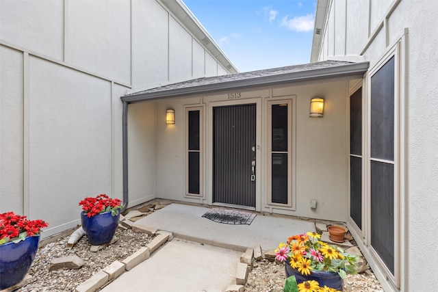 1513 Elk Grove Dr, Richardson, TX 75081 - view of exterior entry featuring board and batten siding