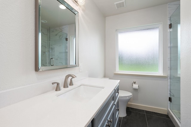 5710 Forest Ln, Dallas, TX 75230 - bathroom featuring healthy amount of natural light, vanity, tile patterned flooring, and a shower stall