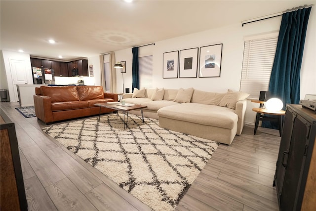 3117 Harper St, Little Elm, TX 75068 - living area featuring light wood-style flooring and recessed lighting
