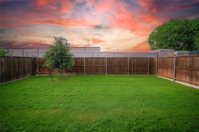3117 Harper St, Little Elm, TX 75068 - yard at dusk with a fenced backyard