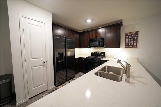 3117 Harper St, Little Elm, TX 75068 - kitchen featuring black appliances, dark brown cabinetry, and a desk