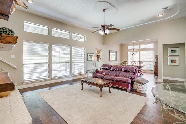 107 Sundance Ct, Hudson Oaks, TX 76087 - living area featuring a ceiling fan, a chandelier, dark wood finished floors, a towering ceiling, and recessed lighting