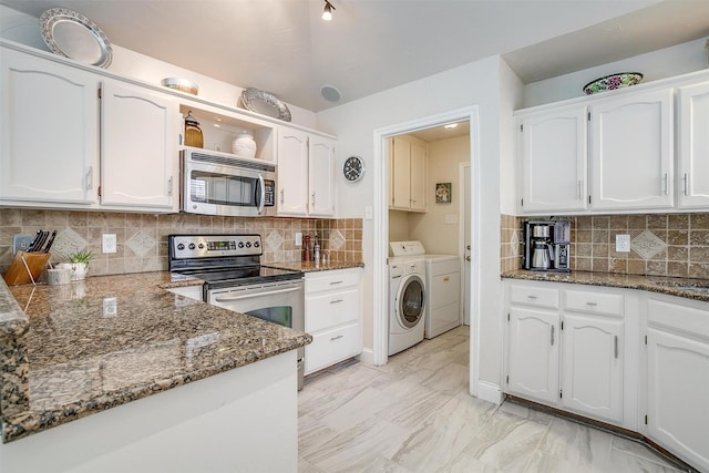 107 Sundance Ct, Hudson Oaks, TX 76087 - kitchen featuring appliances with stainless steel finishes, independent washer and dryer, white cabinets, dark stone countertops, and tasteful backsplash
