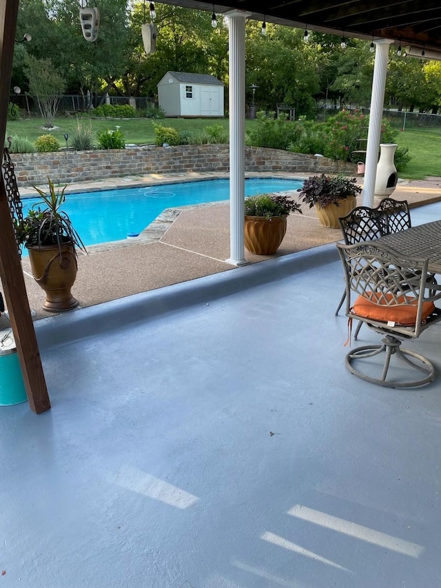 107 Sundance Ct, Hudson Oaks, TX 76087 - view of swimming pool with a shed and a patio