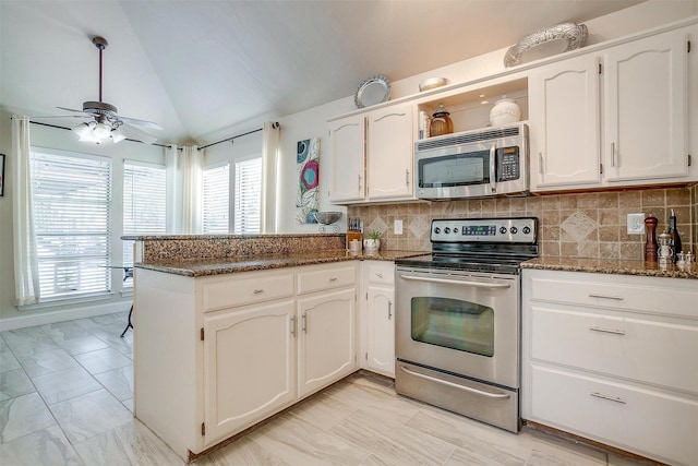 107 Sundance Ct, Hudson Oaks, TX 76087 - kitchen with appliances with stainless steel finishes, vaulted ceiling, a peninsula, white cabinets, and ceiling fan