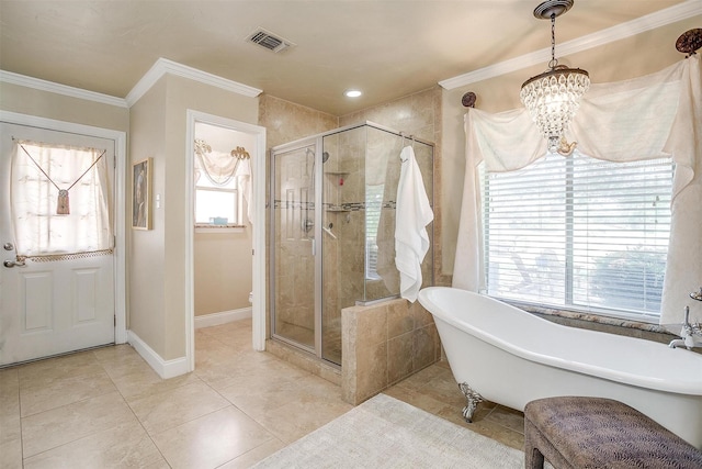 107 Sundance Ct, Hudson Oaks, TX 76087 - bathroom featuring a freestanding tub, a shower stall, a chandelier, crown molding, and tile patterned floors