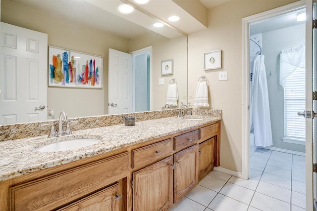 107 Sundance Ct, Hudson Oaks, TX 76087 - bathroom featuring double vanity and tile patterned floors