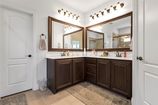 303 Hidden Cove Dr, Ponder, TX 76259 - bathroom featuring double vanity, a shower, and tile patterned flooring