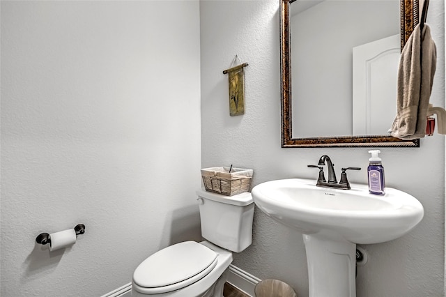 303 Hidden Cove Dr, Ponder, TX 76259 - half bathroom featuring toilet and a textured wall