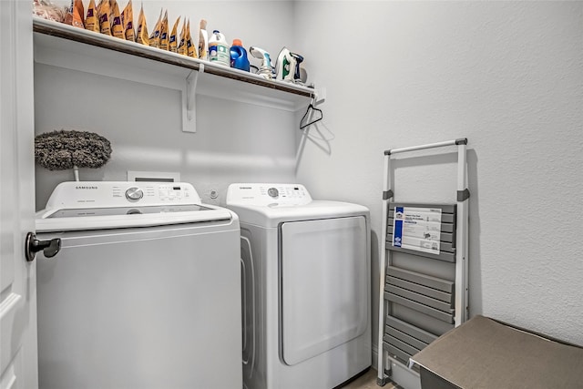 303 Hidden Cove Dr, Ponder, TX 76259 - laundry room with washer and clothes dryer and a textured wall