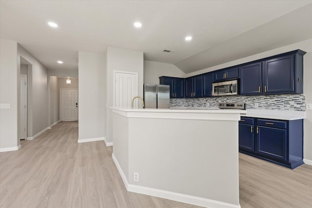 1909 Morning Dove, Aubrey, TX 76227 - kitchen featuring appliances with stainless steel finishes, blue cabinetry, light countertops, tasteful backsplash, and vaulted ceiling