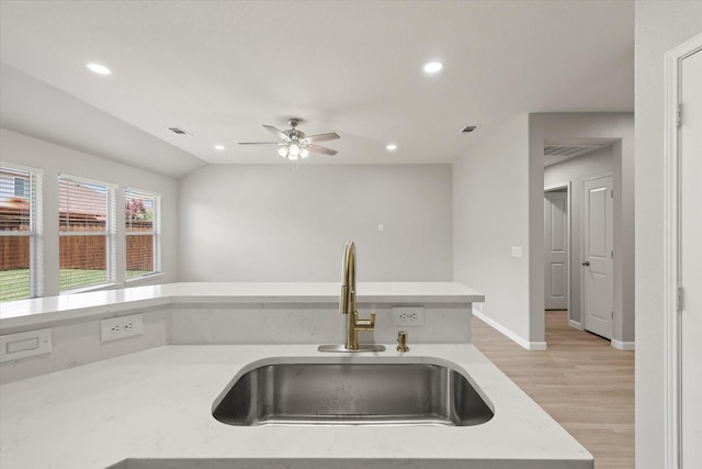 1909 Morning Dove, Aubrey, TX 76227 - kitchen featuring recessed lighting, ceiling fan, light wood-type flooring, and light stone countertops