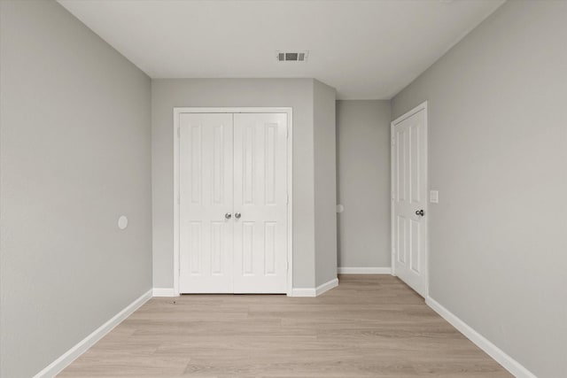 1909 Morning Dove, Aubrey, TX 76227 - unfurnished bedroom featuring light wood-style floors and a closet