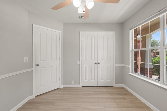 1909 Morning Dove, Aubrey, TX 76227 - unfurnished bedroom with light wood finished floors, a closet, and ceiling fan