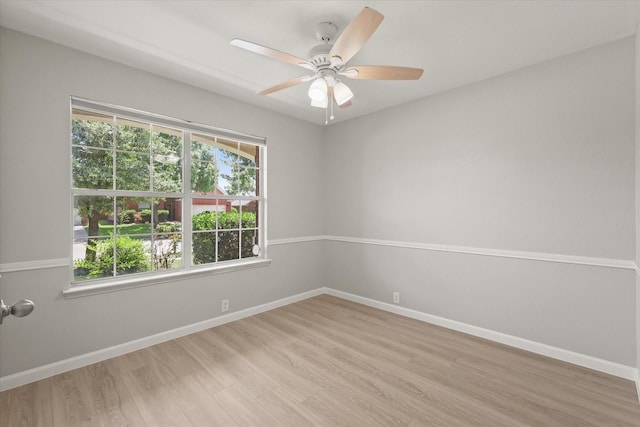 1909 Morning Dove, Aubrey, TX 76227 - unfurnished room featuring healthy amount of natural light, light wood-type flooring, and a ceiling fan