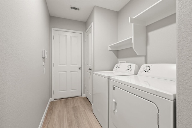 1909 Morning Dove, Aubrey, TX 76227 - laundry room featuring separate washer and dryer and light wood-style floors