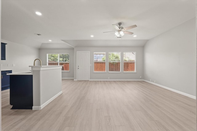 1909 Morning Dove, Aubrey, TX 76227 - unfurnished living room featuring a ceiling fan, vaulted ceiling, light wood-style floors, and recessed lighting