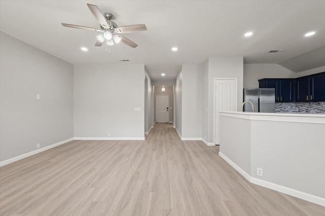1909 Morning Dove, Aubrey, TX 76227 - unfurnished living room with a ceiling fan, light wood-style flooring, and recessed lighting