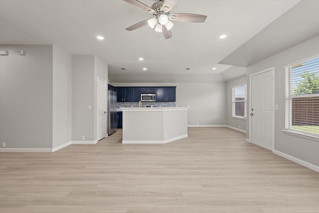 1909 Morning Dove, Aubrey, TX 76227 - unfurnished living room with light wood-style flooring, recessed lighting, and a ceiling fan