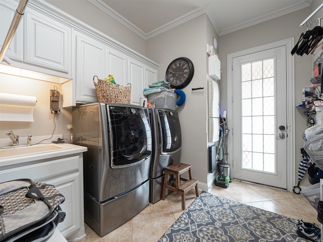 1501 Reata Dr, Carrollton, TX 75010 - laundry area featuring cabinet space, independent washer and dryer, light tile patterned floors, plenty of natural light, and crown molding