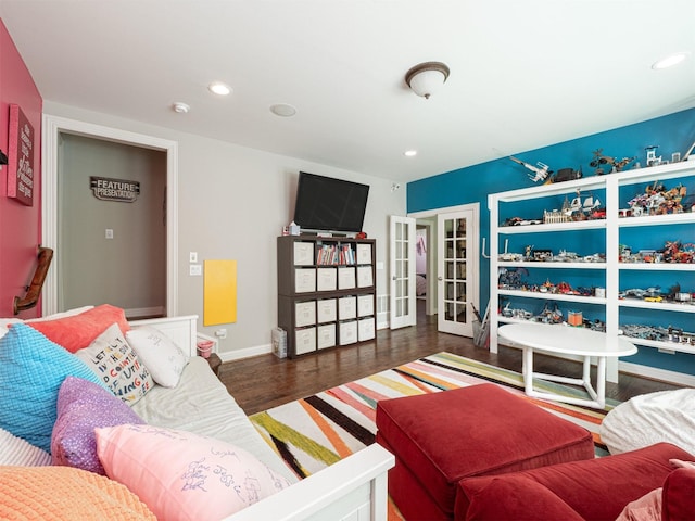 1501 Reata Dr, Carrollton, TX 75010 - living area featuring wood finished floors, french doors, and recessed lighting