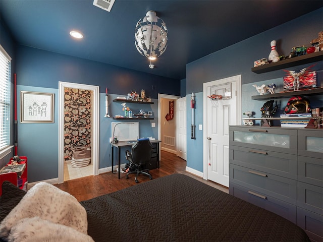 1501 Reata Dr, Carrollton, TX 75010 - bedroom with a desk, wood finished floors, ensuite bathroom, and recessed lighting