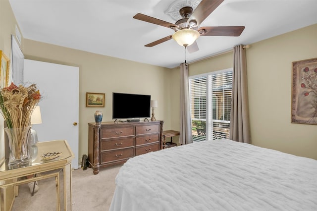10763 Villager Unit A, Dallas, TX 75230 - bedroom with light colored carpet and ceiling fan