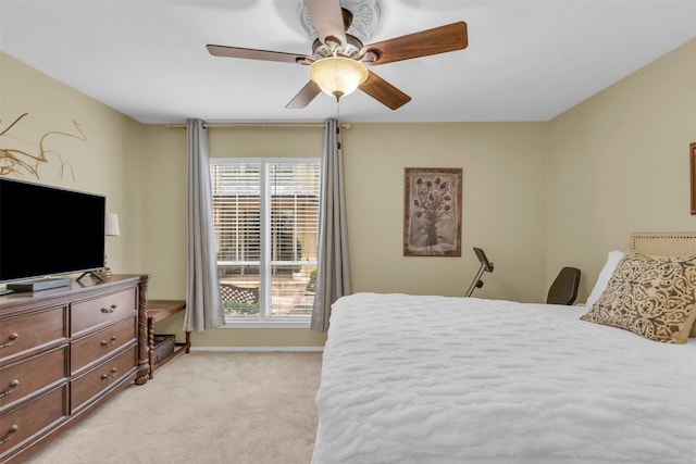 10763 Villager Unit A, Dallas, TX 75230 - bedroom featuring light carpet and ceiling fan