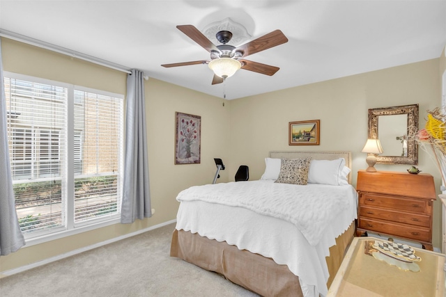 10763 Villager Unit A, Dallas, TX 75230 - bedroom featuring light carpet and ceiling fan