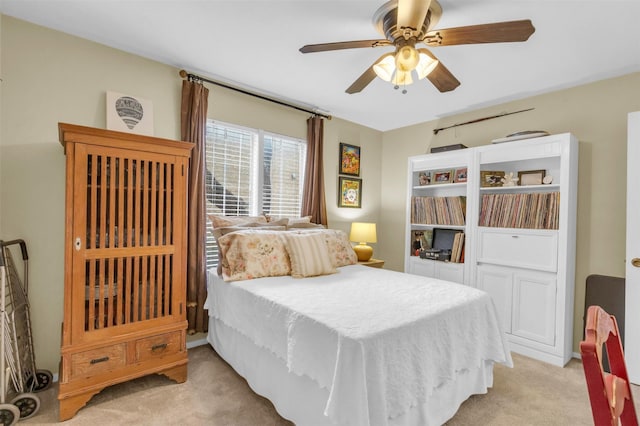 10763 Villager Unit A, Dallas, TX 75230 - bedroom with light colored carpet and ceiling fan