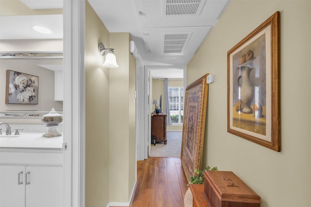 10763 Villager Unit A, Dallas, TX 75230 - hallway featuring wood finished floors and baseboards