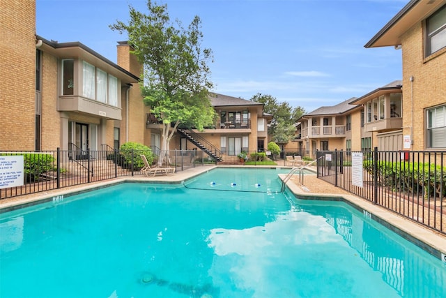10763 Villager Unit A, Dallas, TX 75230 - community pool with a residential view