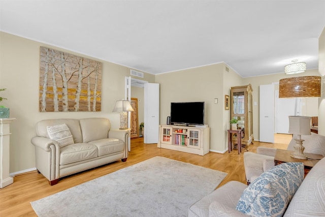 10763 Villager Unit A, Dallas, TX 75230 - living room featuring wood finished floors and crown molding