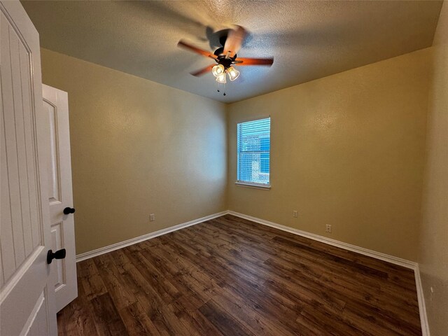 205 Boardwalk Ave, Waxahachie, TX 75165 - empty room featuring dark wood-style floors, ceiling fan, and a textured ceiling