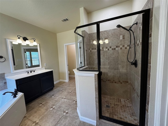 205 Boardwalk Ave, Waxahachie, TX 75165 - bathroom featuring vanity, a shower stall, a bath, and tile patterned flooring